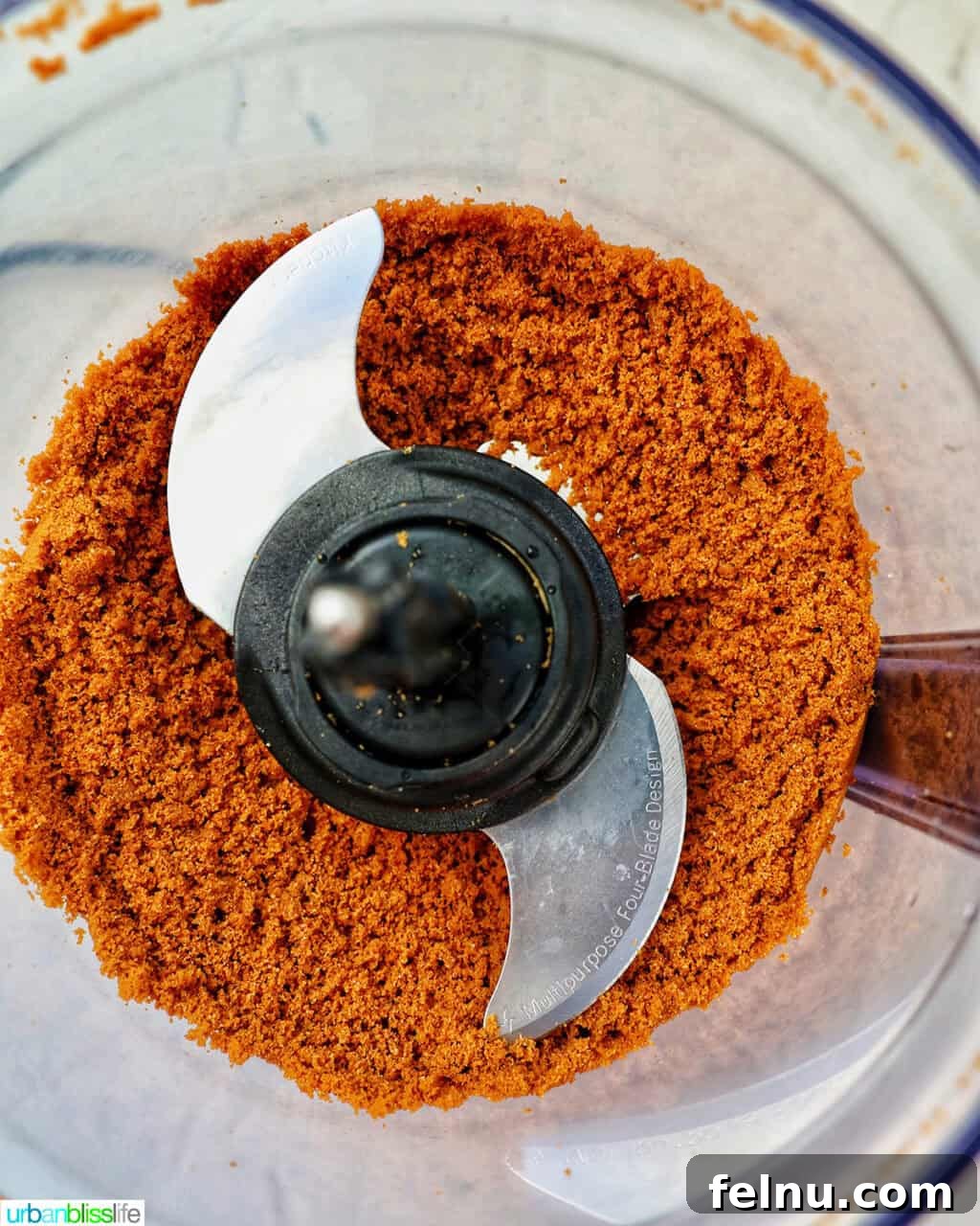 Biscoff Delights 5 Biscoff cookies being crushed into crumbs in a food processor.