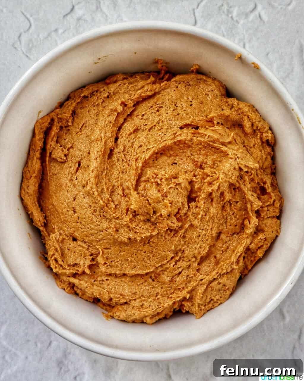 Biscoff Delights 8 Biscoff truffle dough sitting in a bowl, ready to be shaped.