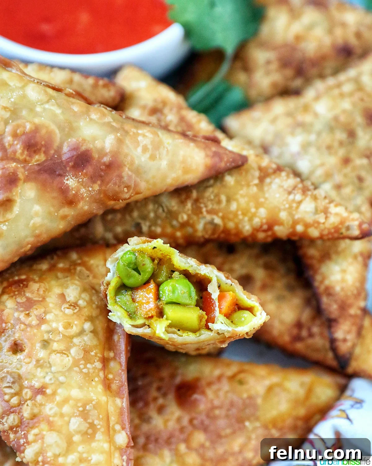 Open vegan curry samosa revealing the flavorful filling.