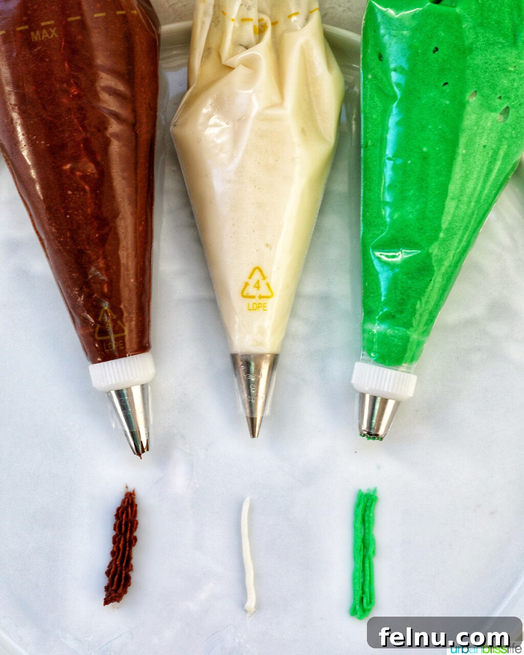 Touchdown Treats 12 Three piping bags filled with chocolate, vanilla, and green buttercream frosting, each with a different piping tip.