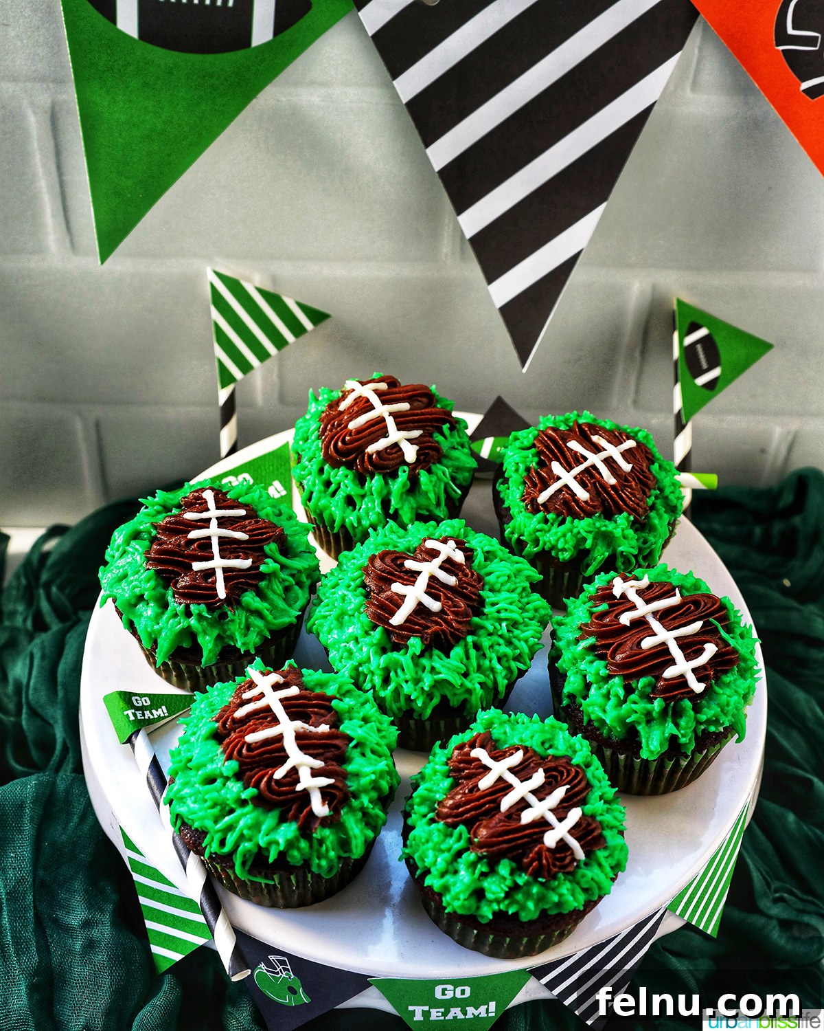 Touchdown Treats 17 Football cupcakes decorated with green frosting on a cake stand, ready for a party.