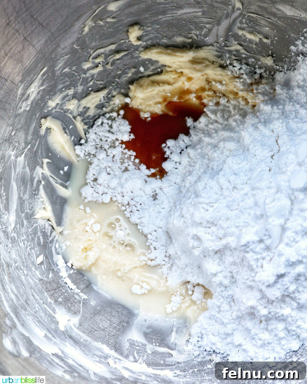 Touchdown Treats 7 Ingredients for chocolate buttercream frosting in a stand mixing bowl.