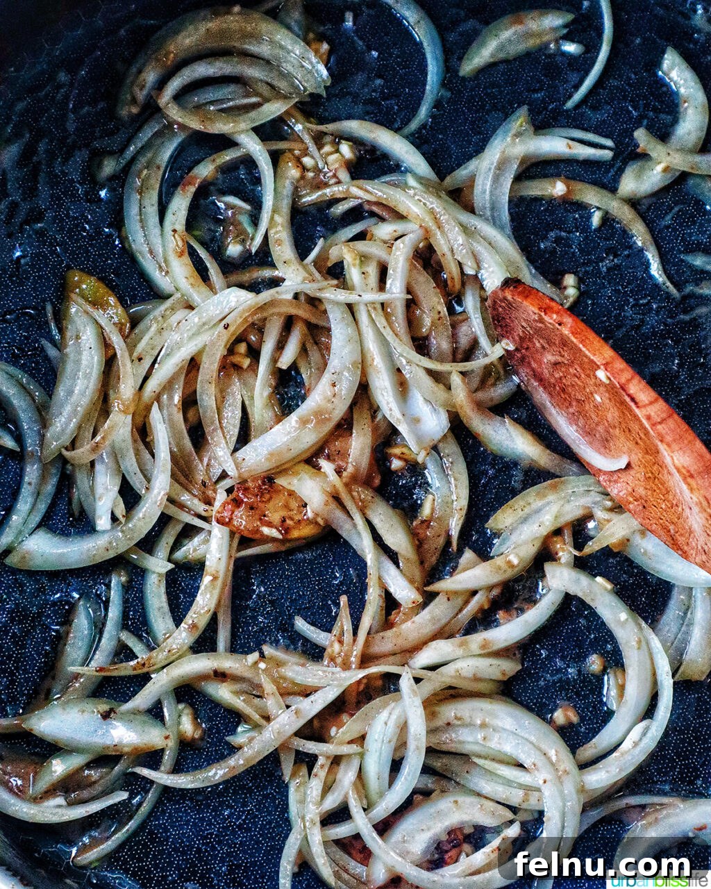 Savory Beef and Onion Skillet 11 Cooking sliced onions in a pan