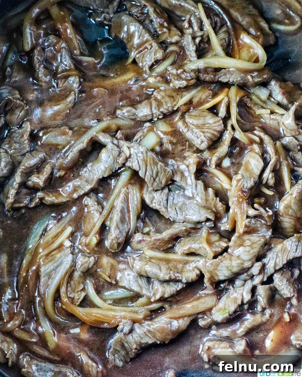 Savory Beef and Onion Skillet 15 Beef and onions cooking in stir fry sauce