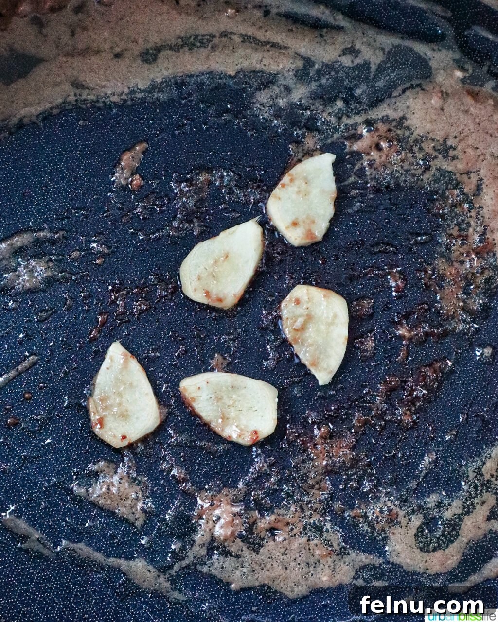 Savory Beef and Onion Skillet 10 Sautéing sliced ginger in a pan