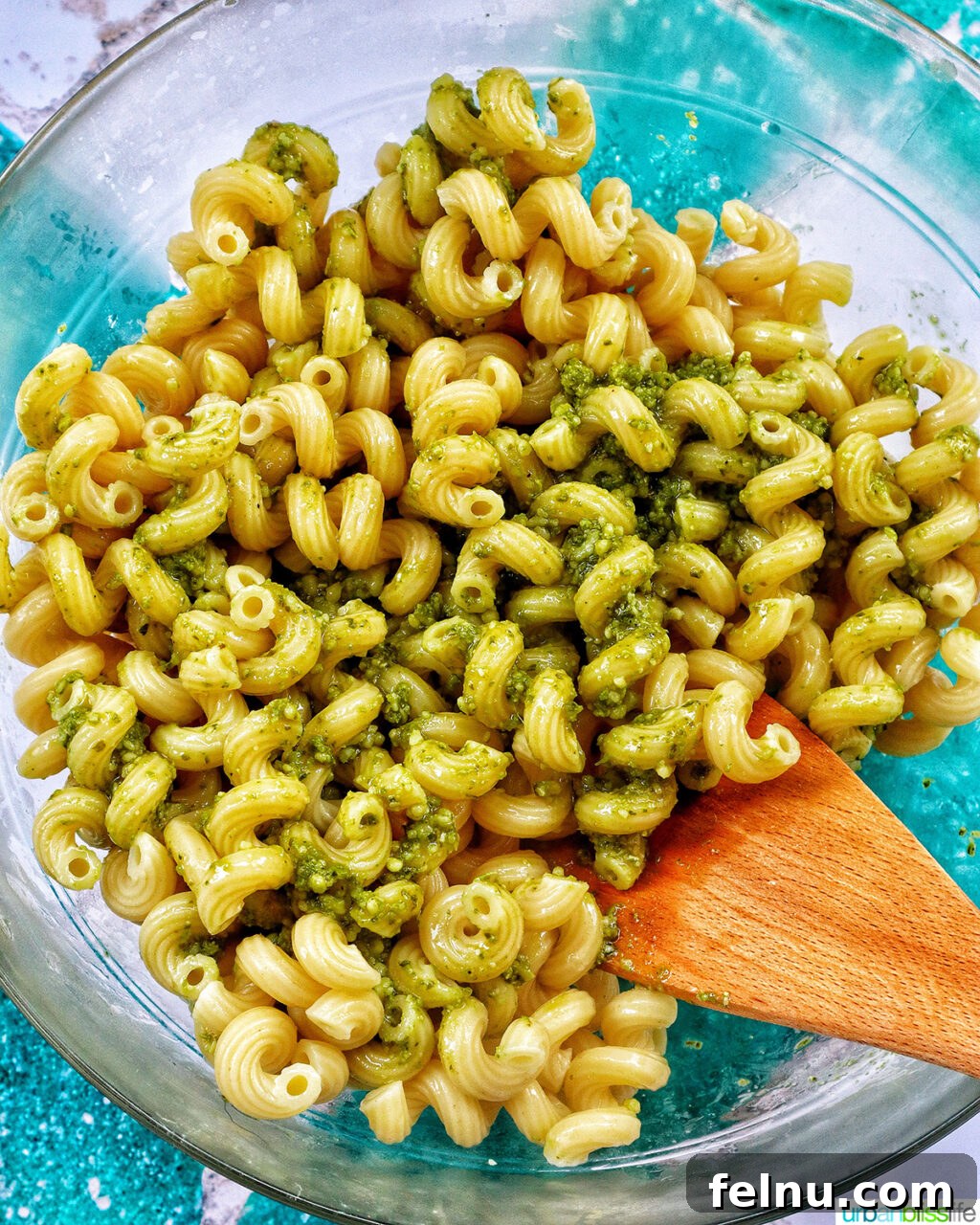 Bacon Pesto Pasta Delight 12 Tossing pasta and pesto together