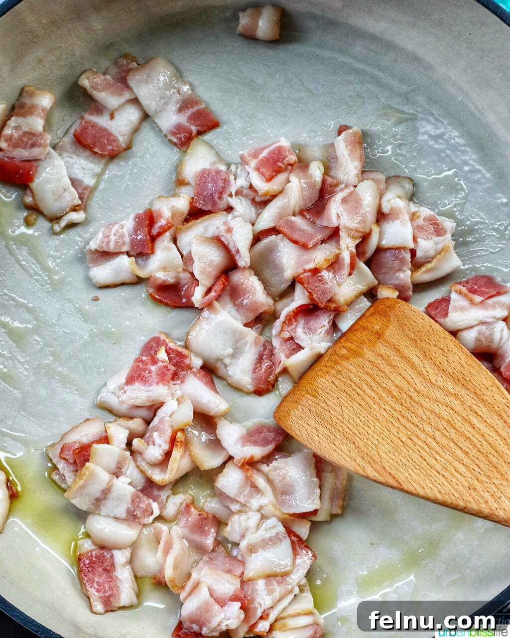 Bacon Pesto Pasta Delight 7 Bacon cooking in a pan