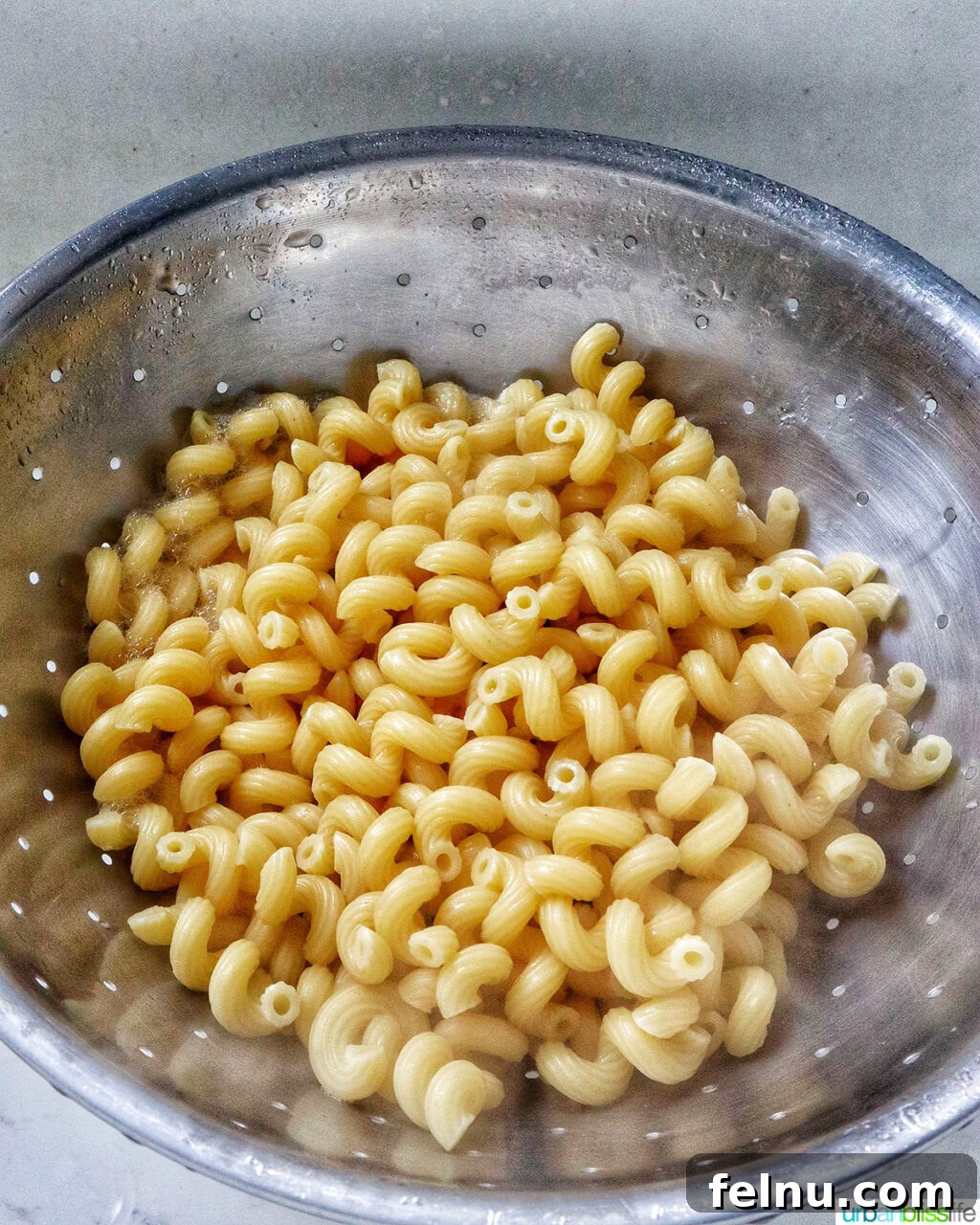 Bacon Pesto Pasta Delight 10 Pasta in a colander