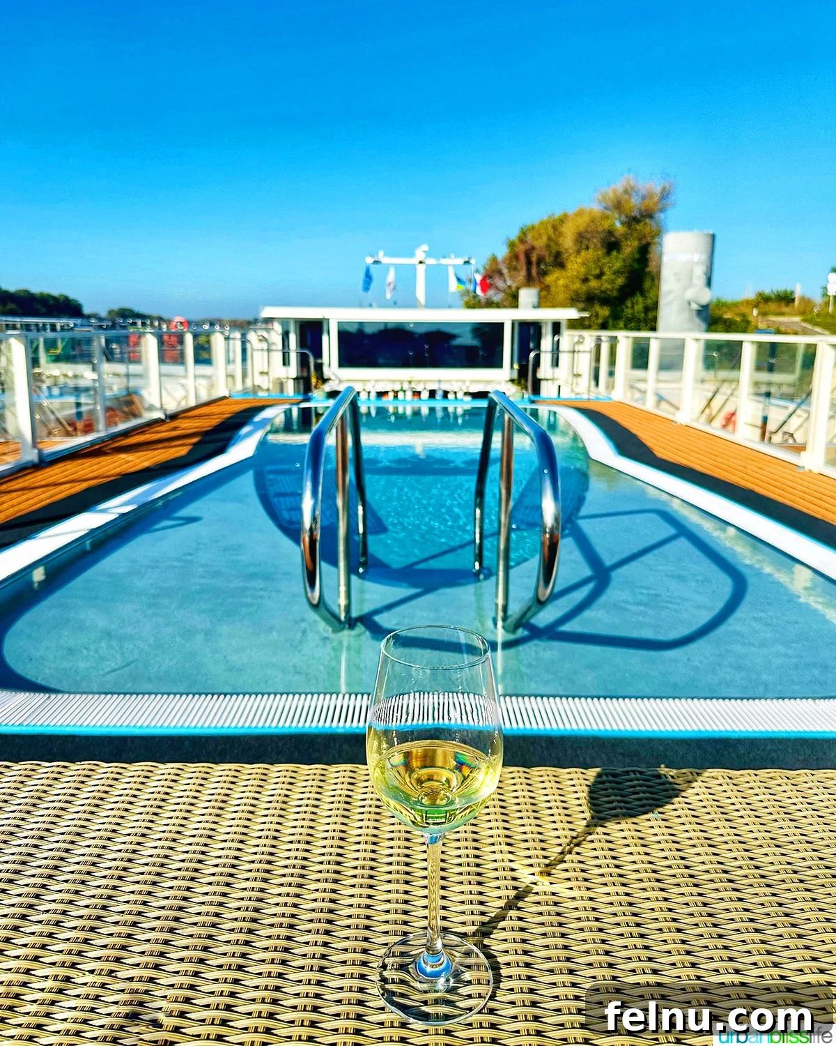 River Cruise: A Beginner's Bliss 7 Glass of white wine in front of pool aboard AmaWaterways AmaKristina river cruise ship