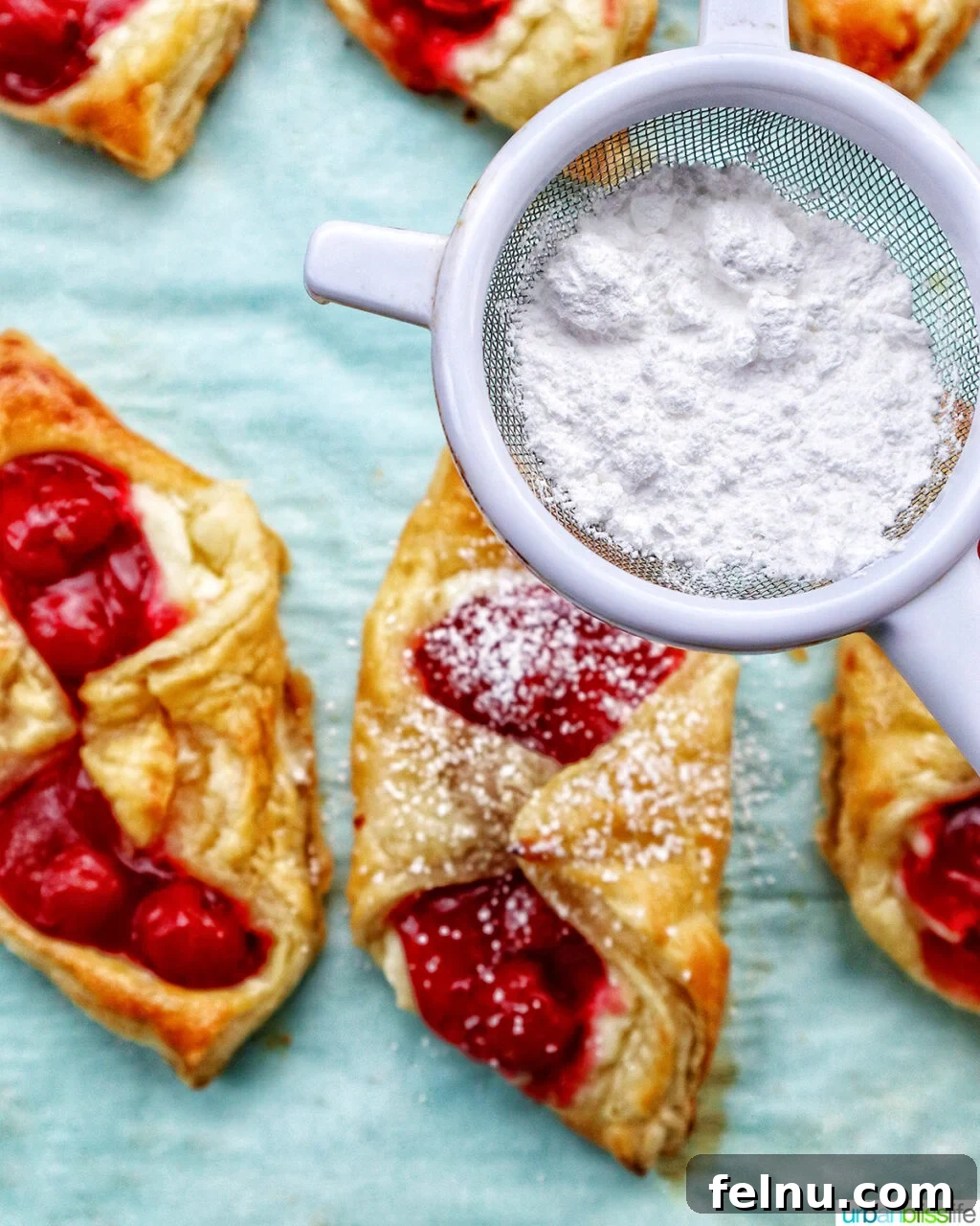 Cherry danishes with powdered sugar