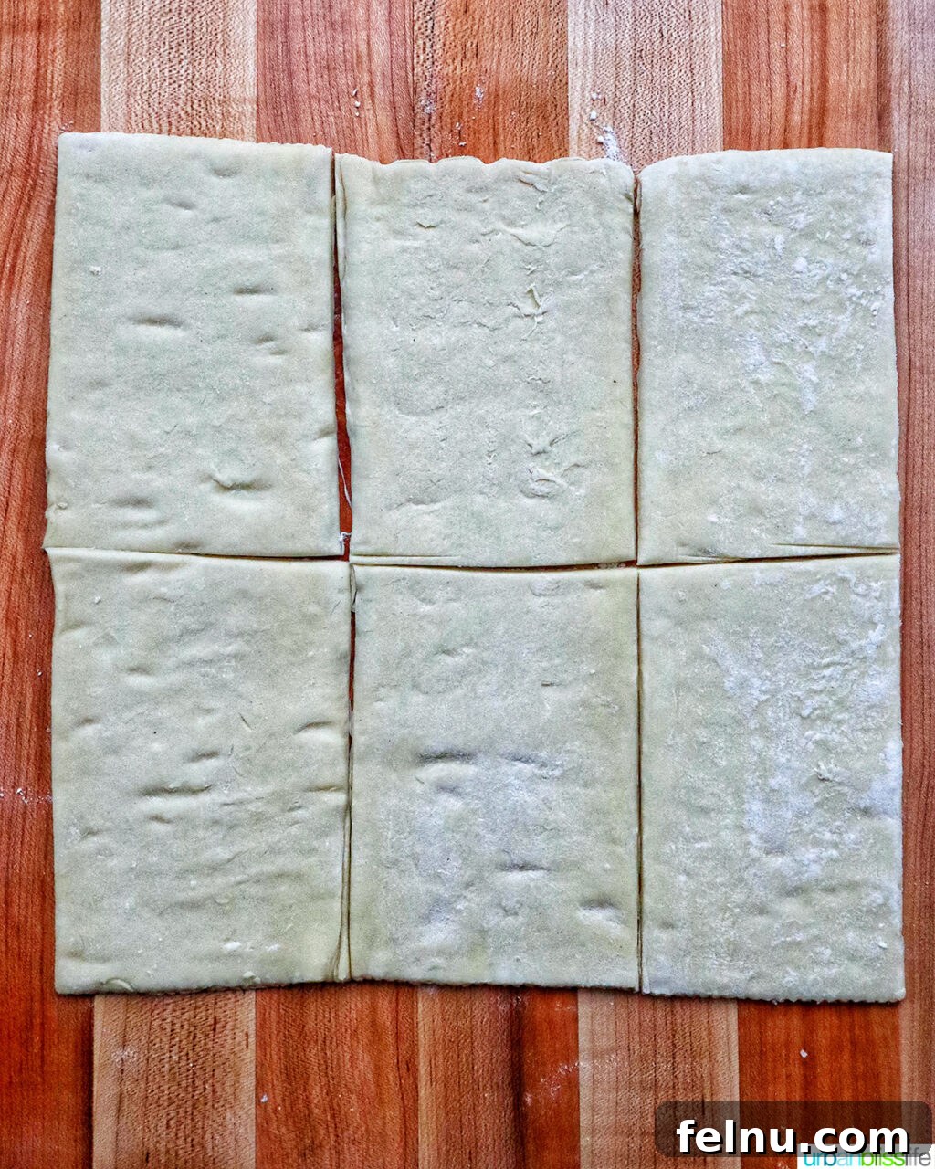 Puff pastry sheets on a cutting board