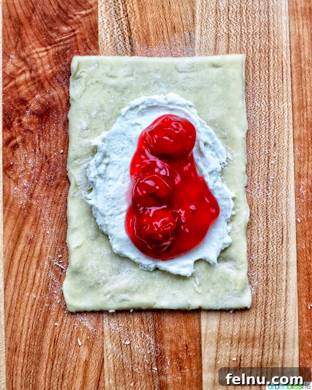 Cherry pie filling over cream cheese and puff pastry