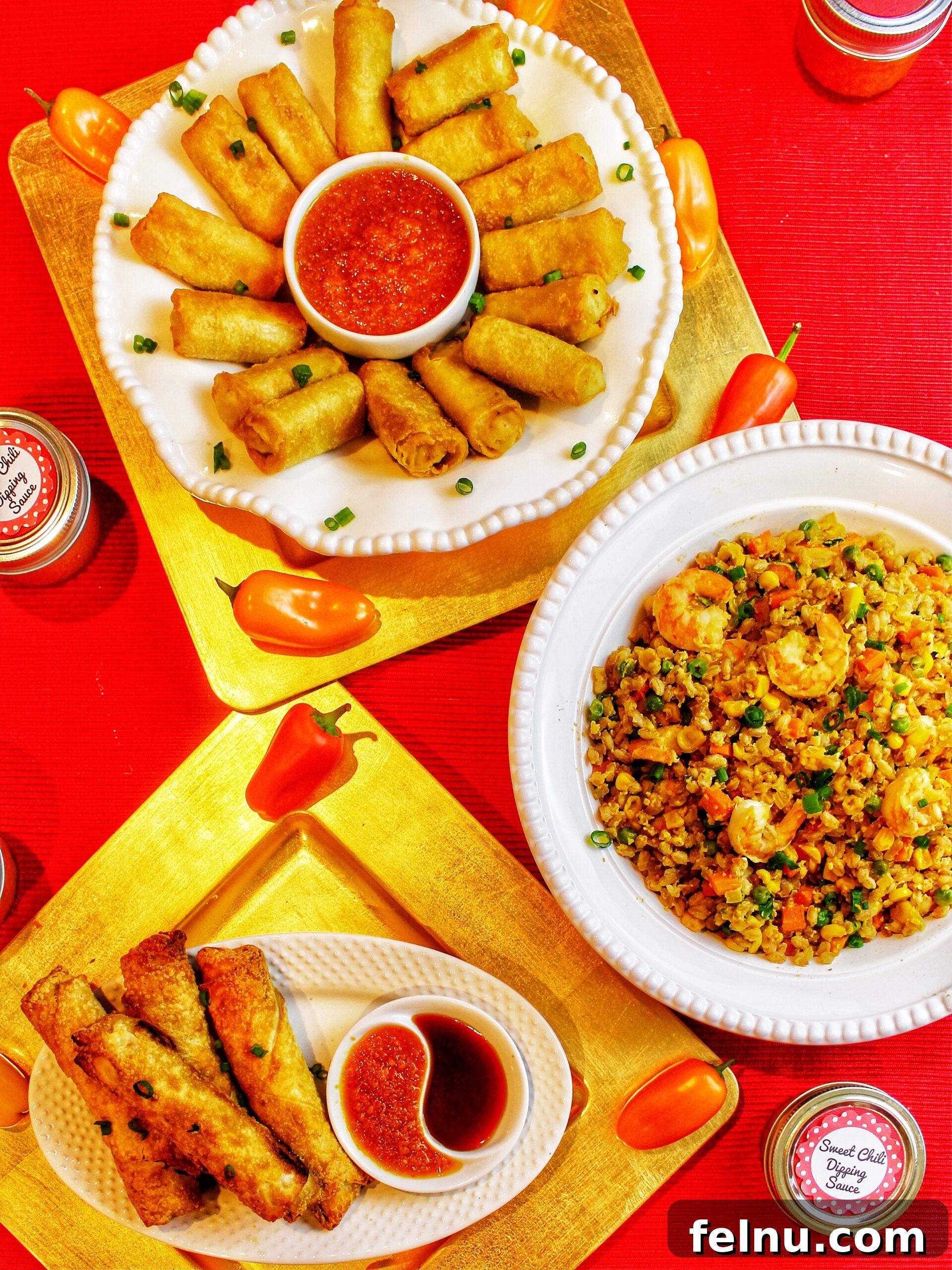 Delicious Recipes to Ring in the Lunar New Year 2 A colorful spread of egg rolls, fried rice, and dumplings, perfect for your Lunar New Year celebration.