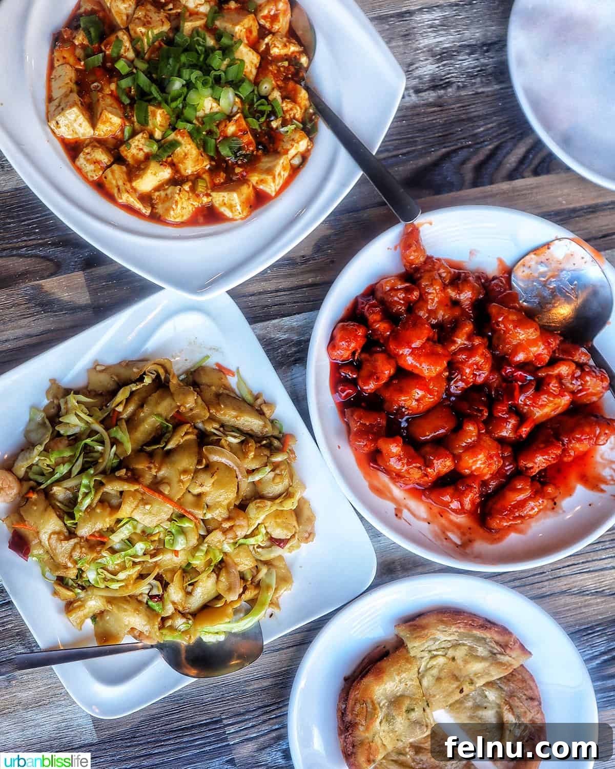 Delicious Recipes to Ring in the Lunar New Year 5 Four plates filled with delicious Chinese dishes at Tasty Corner restaurant in Portland, Oregon.