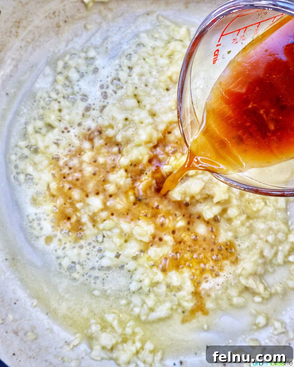 Garlic Parmesan Chicken Pasta
Scrumptious Garlic Parmesan Chicken Pasta 11 Pouring chicken stock over garlic and onions sauteing in butter.