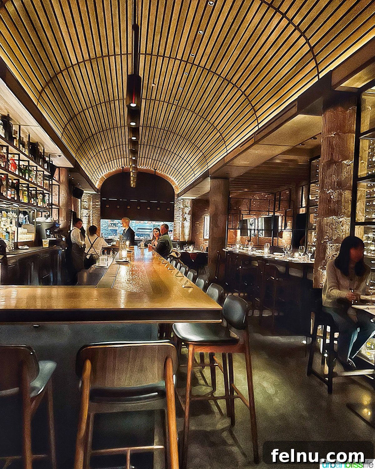 Carlotto's New York Slice 4 The bar and dining room at Carlotto restaurant in NYC, showcasing its inviting atmosphere.