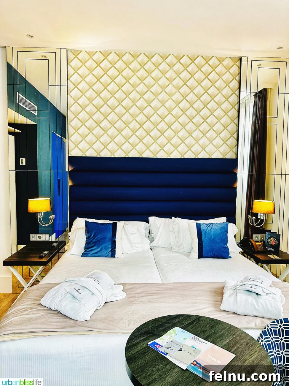 Luxurious king-sized bed in a superior room at Hotel Abba San Sebastian, featuring elegant bedding and a stylish headboard.