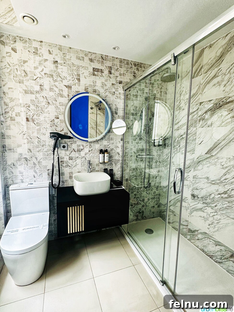 Elegant marble bathroom at Hotel Abba San Sebastian, featuring a modern shower and sophisticated design.