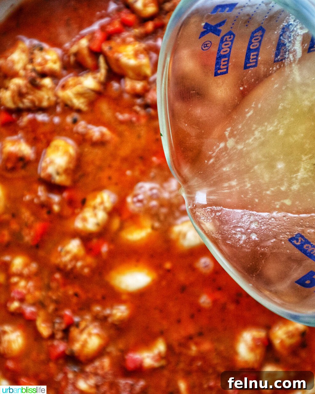 Chorizo Chicken Pasta
Sizzling Chorizo Chicken Pasta 13 Pouring chicken stock into chorizo chicken pasta.