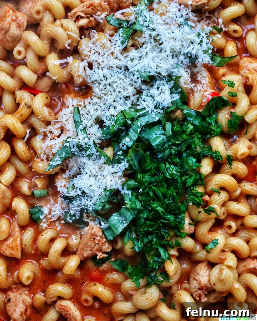 Chorizo Chicken Pasta
Sizzling Chorizo Chicken Pasta 17 Adding herbs and cheese to chorizo chicken pasta.