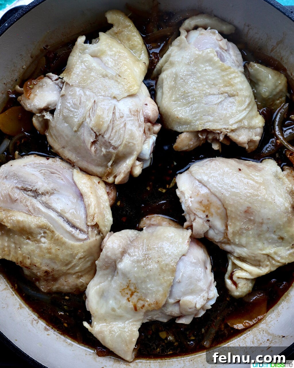 Fragrant Chinese Braised Chicken 12 Seared chicken thighs returned to the skillet with the sauce.