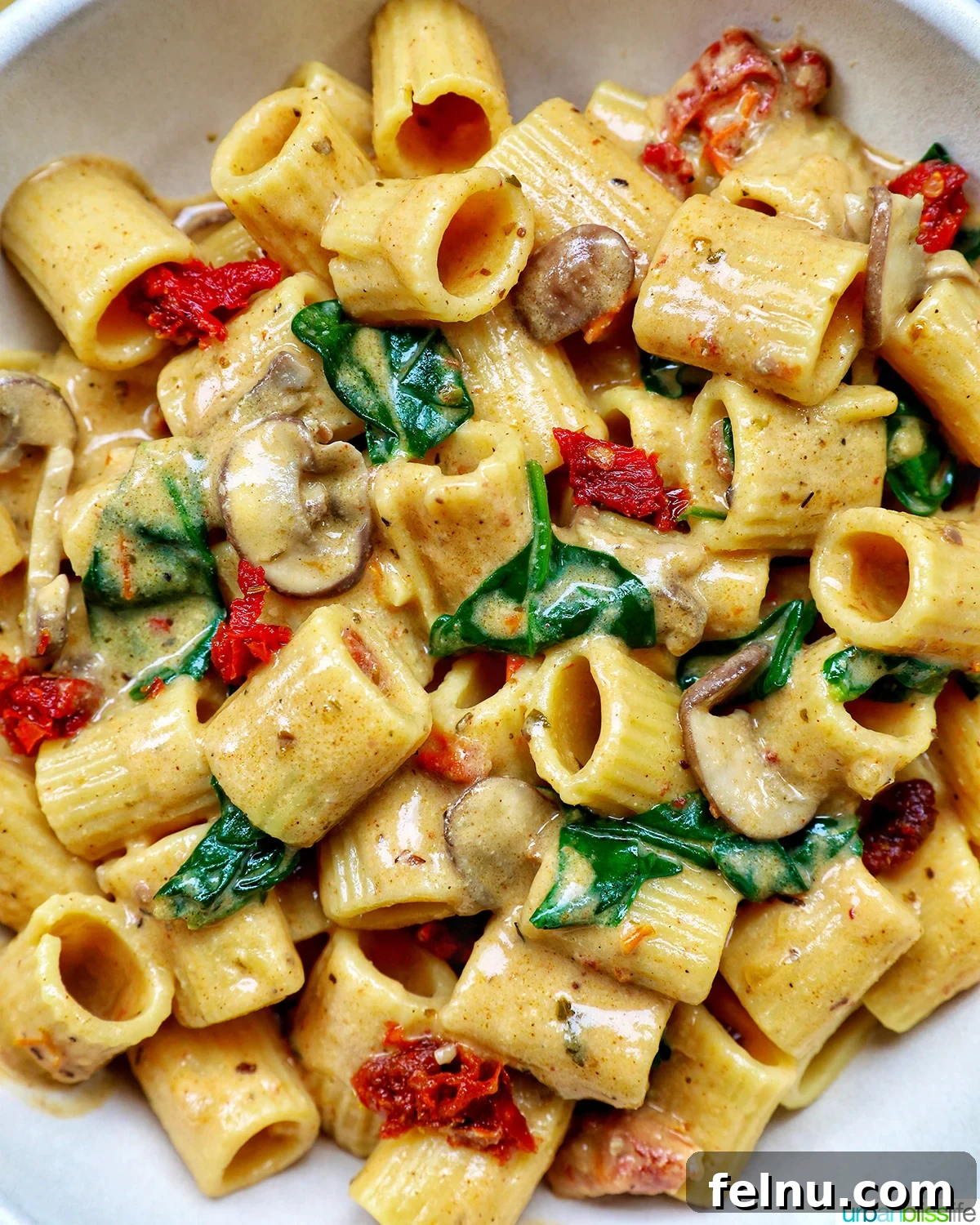 The Proposal Pasta 3 A close-up shot of a single bowl of vegetarian Marry Me Pasta, highlighting the creamy sauce and fresh garnishes.