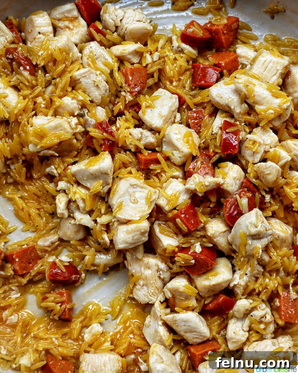 Chicken and Chorizo Orzo Skillet 11 chorizo and chicken cooking in a pan