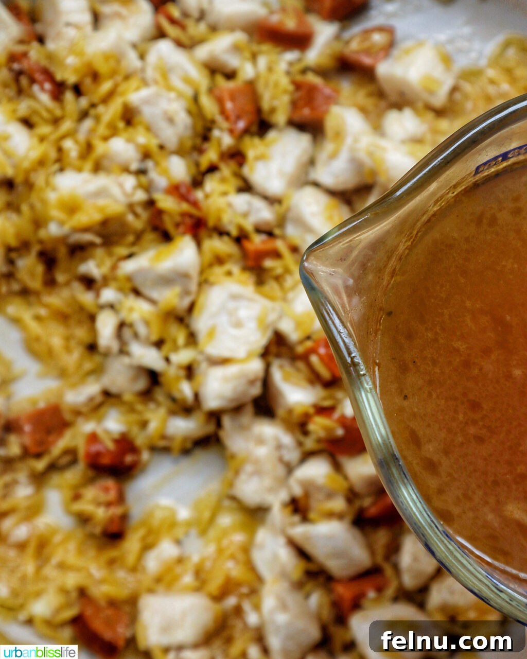 Chicken and Chorizo Orzo Skillet 12 cubed chicken cooking in a pan