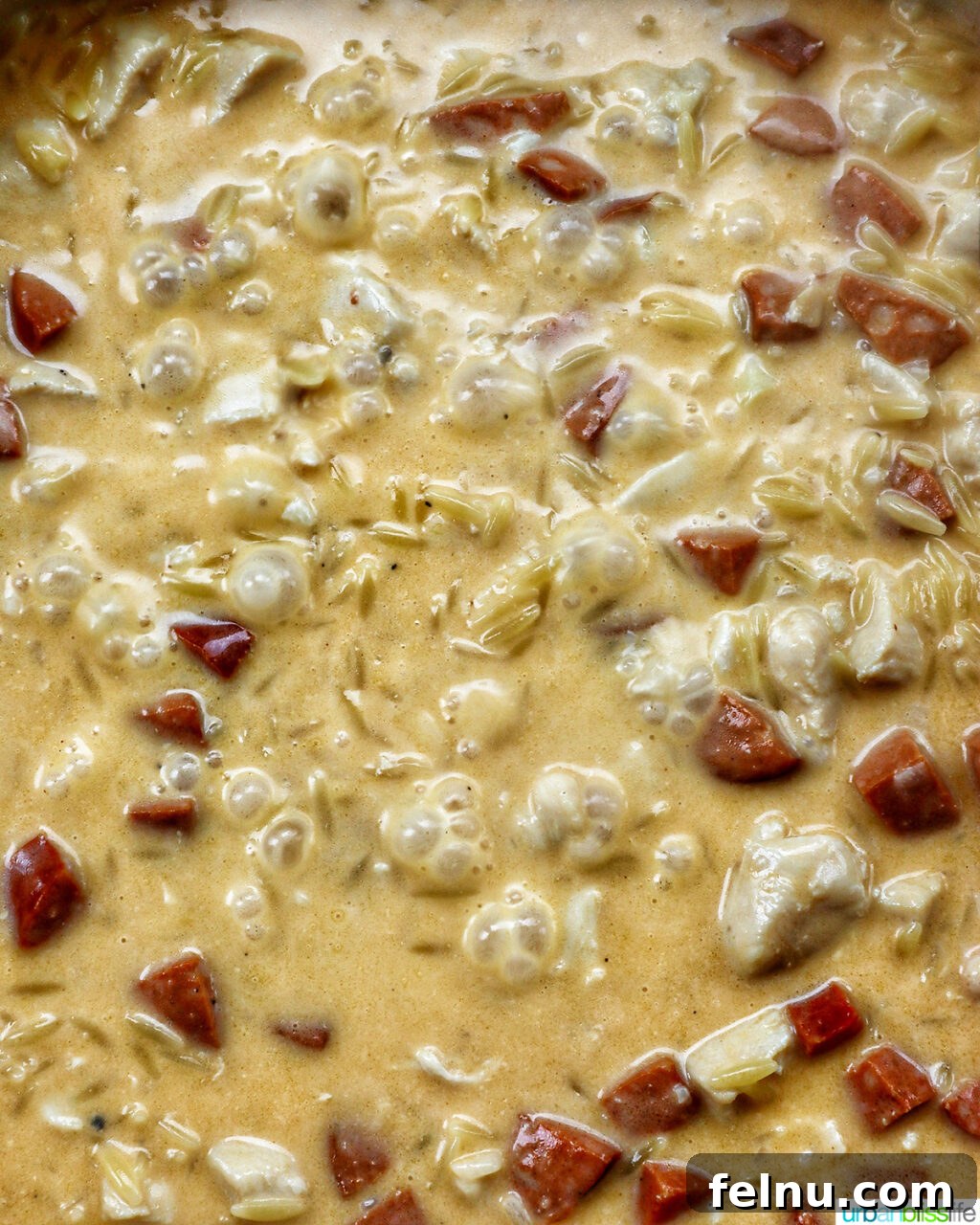 Chicken and Chorizo Orzo Skillet 14 chicken chorizo orzo cooking in a pan