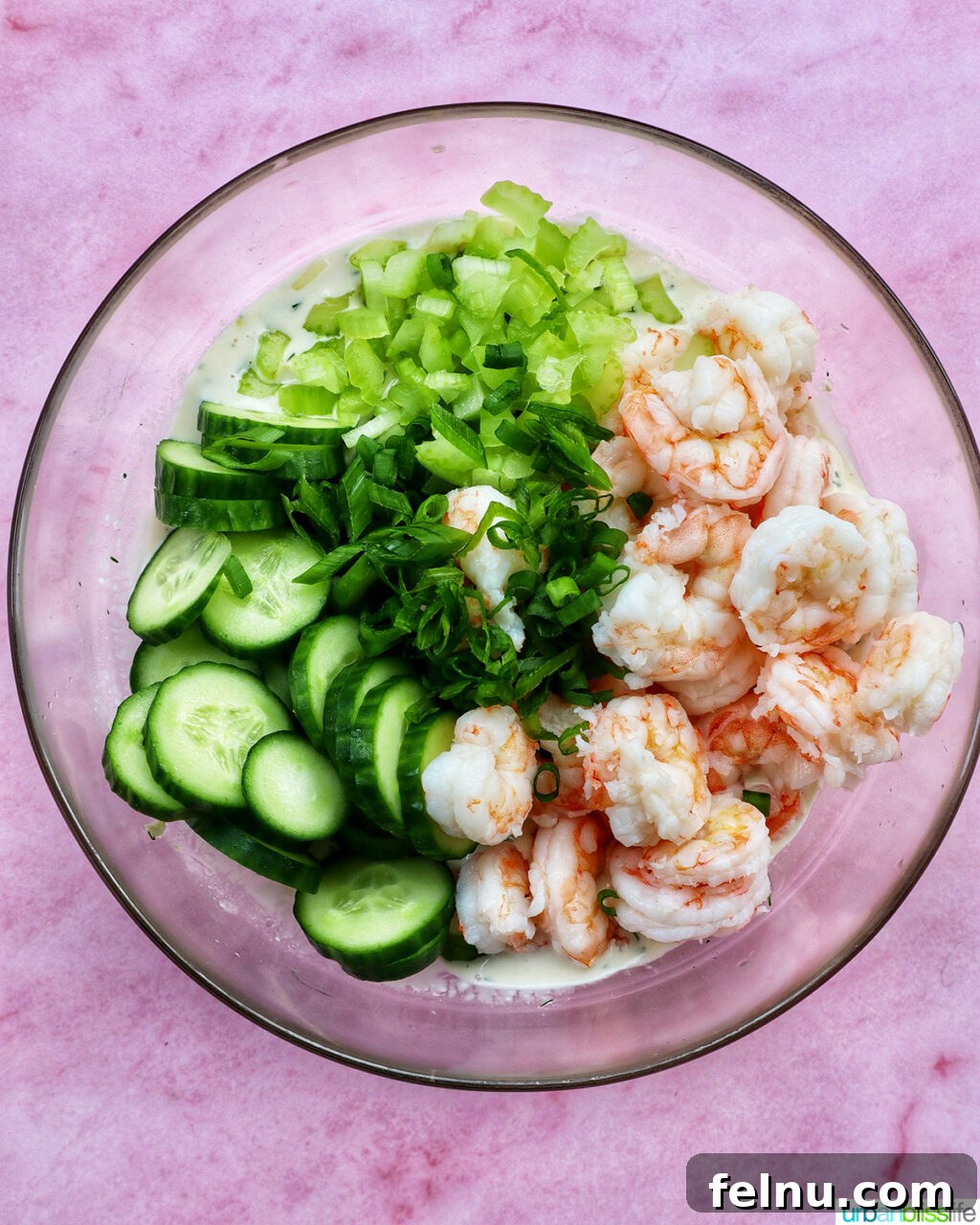 Shrimp, cucumbers, celery in a bowl