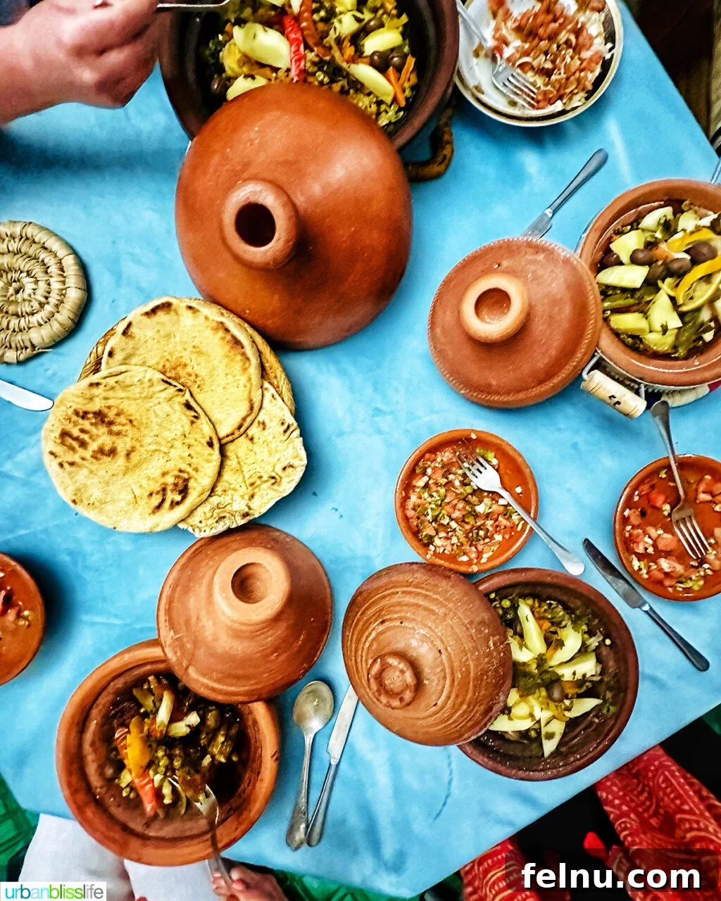 Morocco Unveiled: A 10-Day Journey from Coast to Desert 12 A variety of tagine dishes on a table.