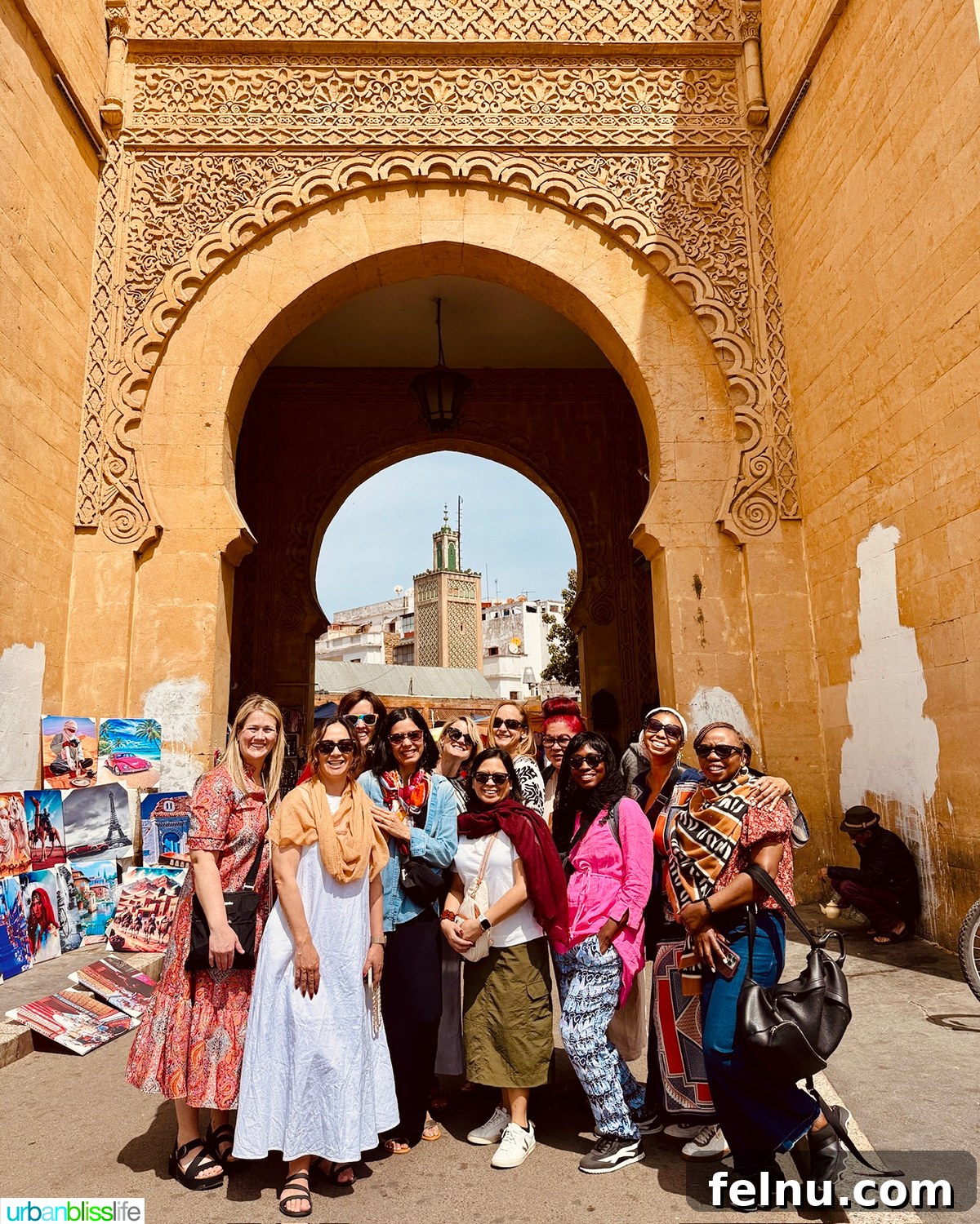Morocco Unveiled: A 10-Day Journey from Coast to Desert 3 A group of travel bloggers in front of the historic entrance to the Casablanca medina.