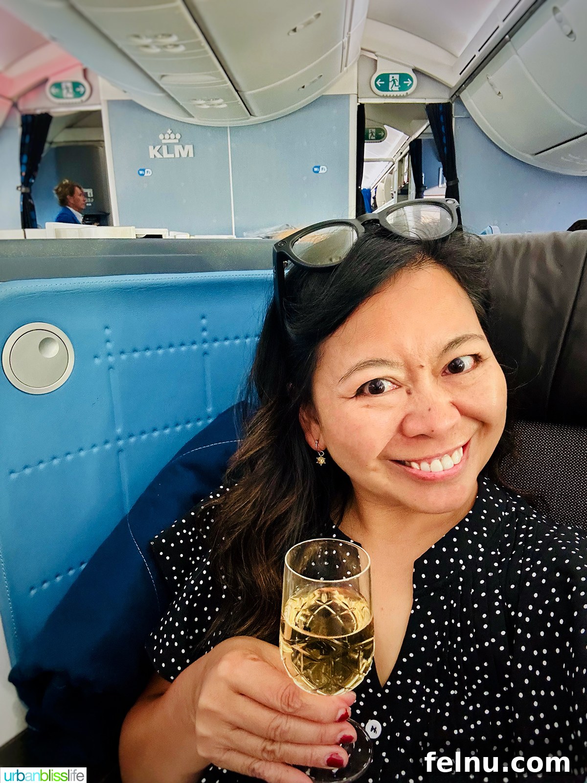 Morocco Unveiled: A 10-Day Journey from Coast to Desert 31 Enjoying a glass of champagne in KLM airlines business class.