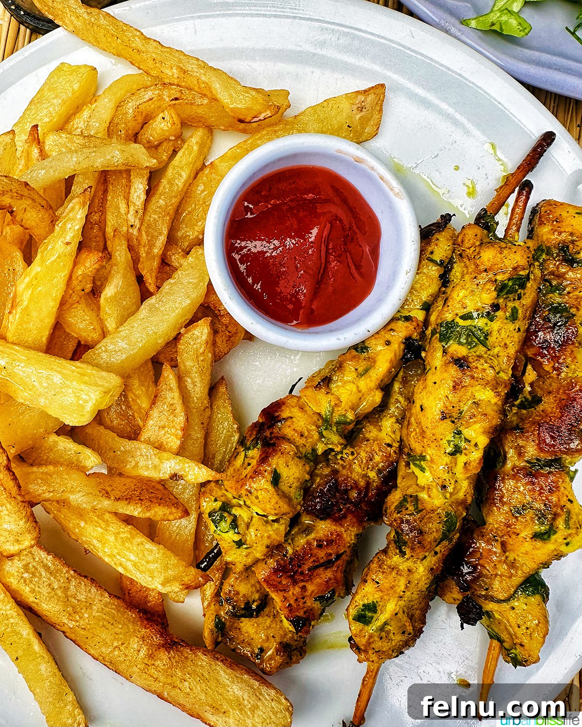Authentic Moroccan Cuisine 14 Moroccan Chicken Skewers served with fries.