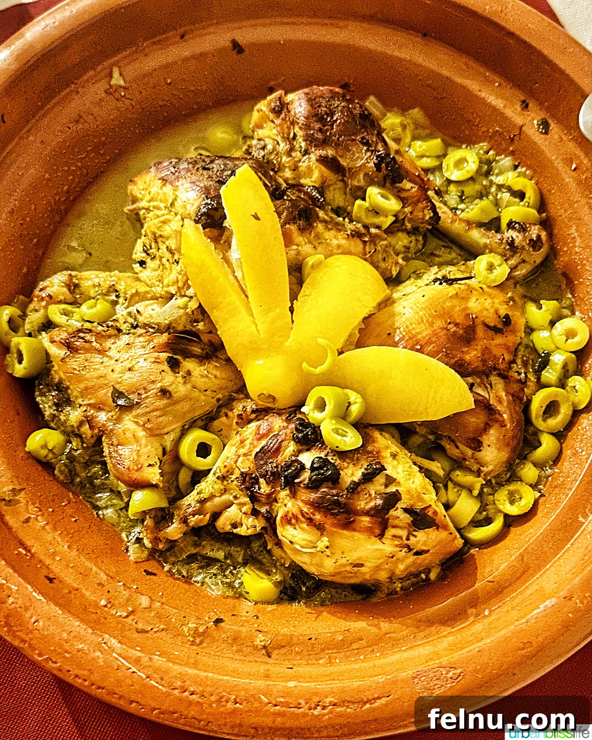 Authentic Moroccan Cuisine 4 A beautifully presented Chicken Tagine with lemons and olives.