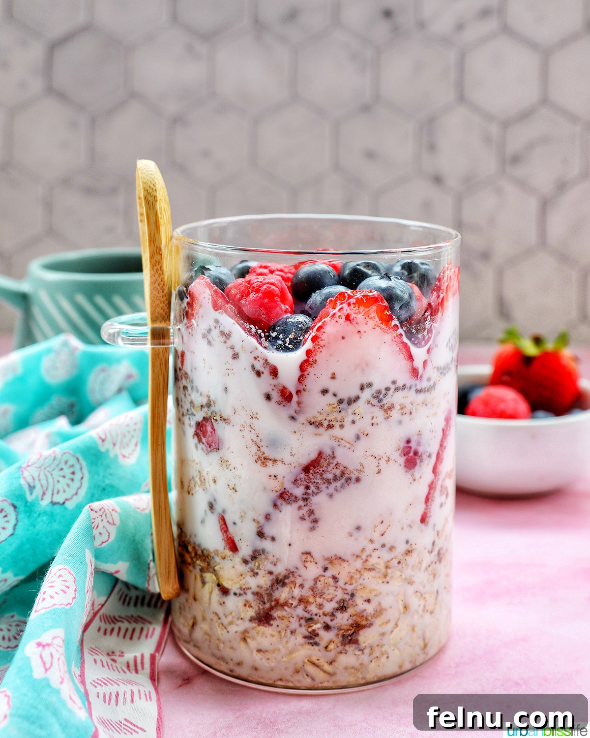 Overnight Berry Bliss 2 Fresh Berry Overnight Oats layered in a clear mason jar, ready for breakfast.