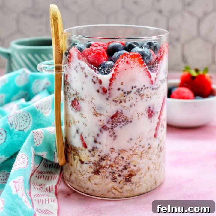Overnight Berry Bliss 10 Berry Overnight Oats in a mason jar, topped with fresh berries, ready for a healthy breakfast.