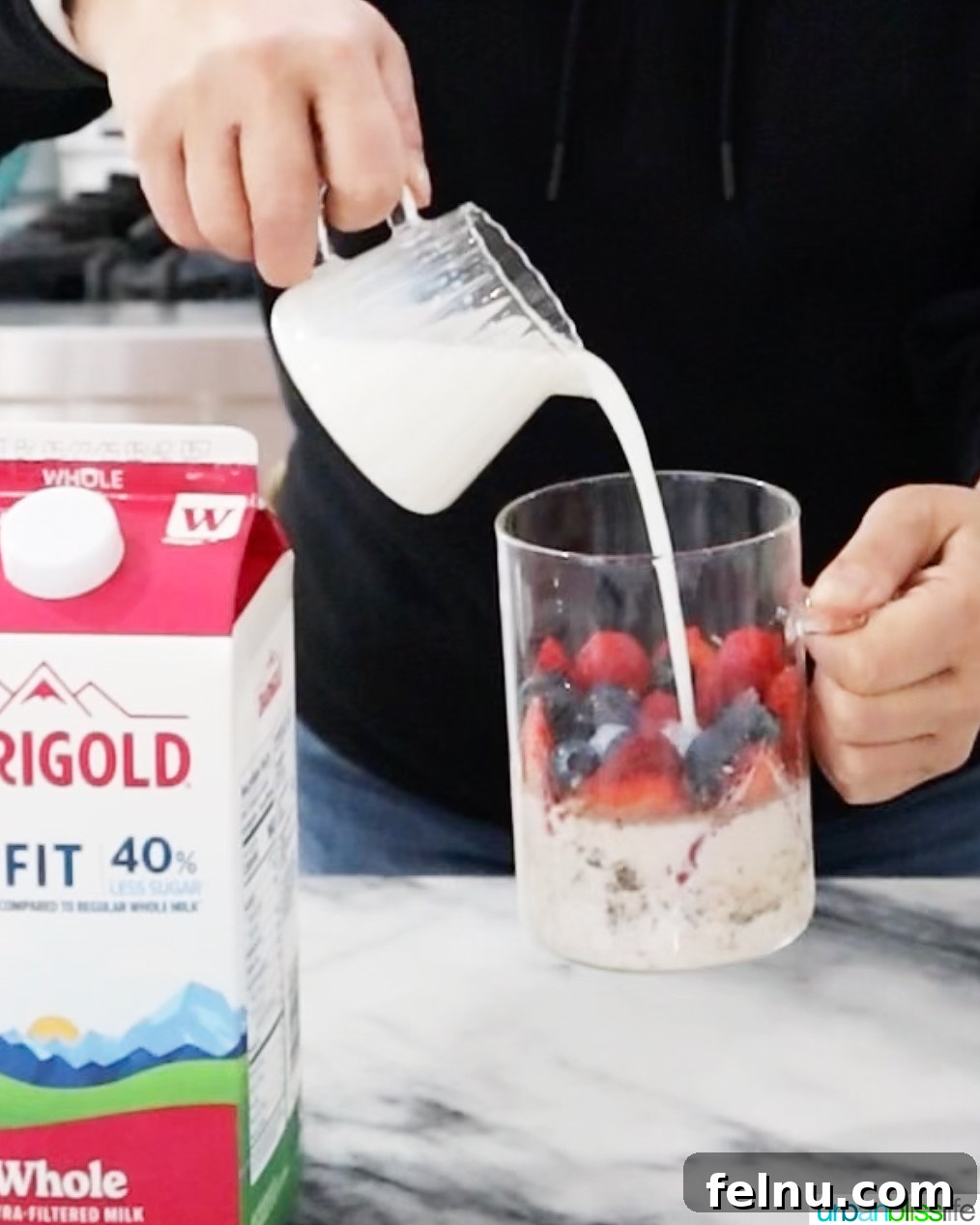 Overnight Berry Bliss 5 Step 1: Adding oats, chia seeds, cinnamon, and vanilla to a mason jar.