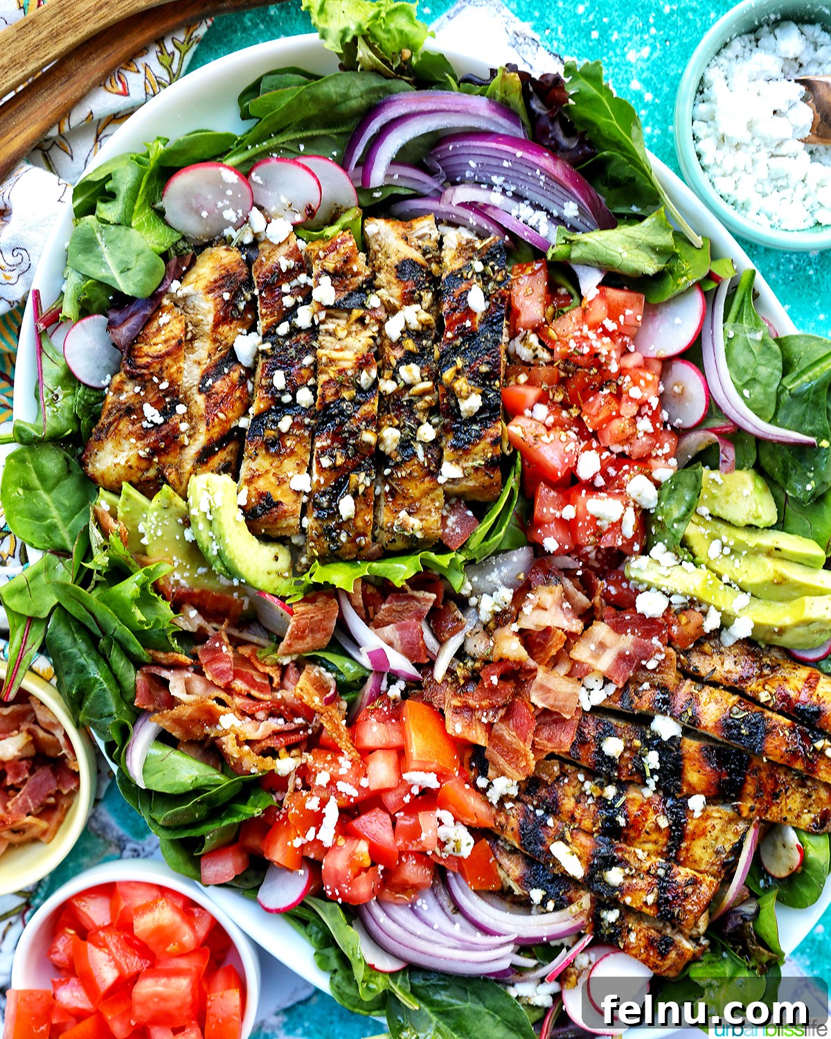 Tangy Balsamic Chicken Greens 2 A stunning plate of Balsamic Chicken Salad, featuring juicy grilled chicken, vibrant greens, cherry tomatoes, creamy avocado, and crumbled feta, drizzled with a homemade balsamic dressing.