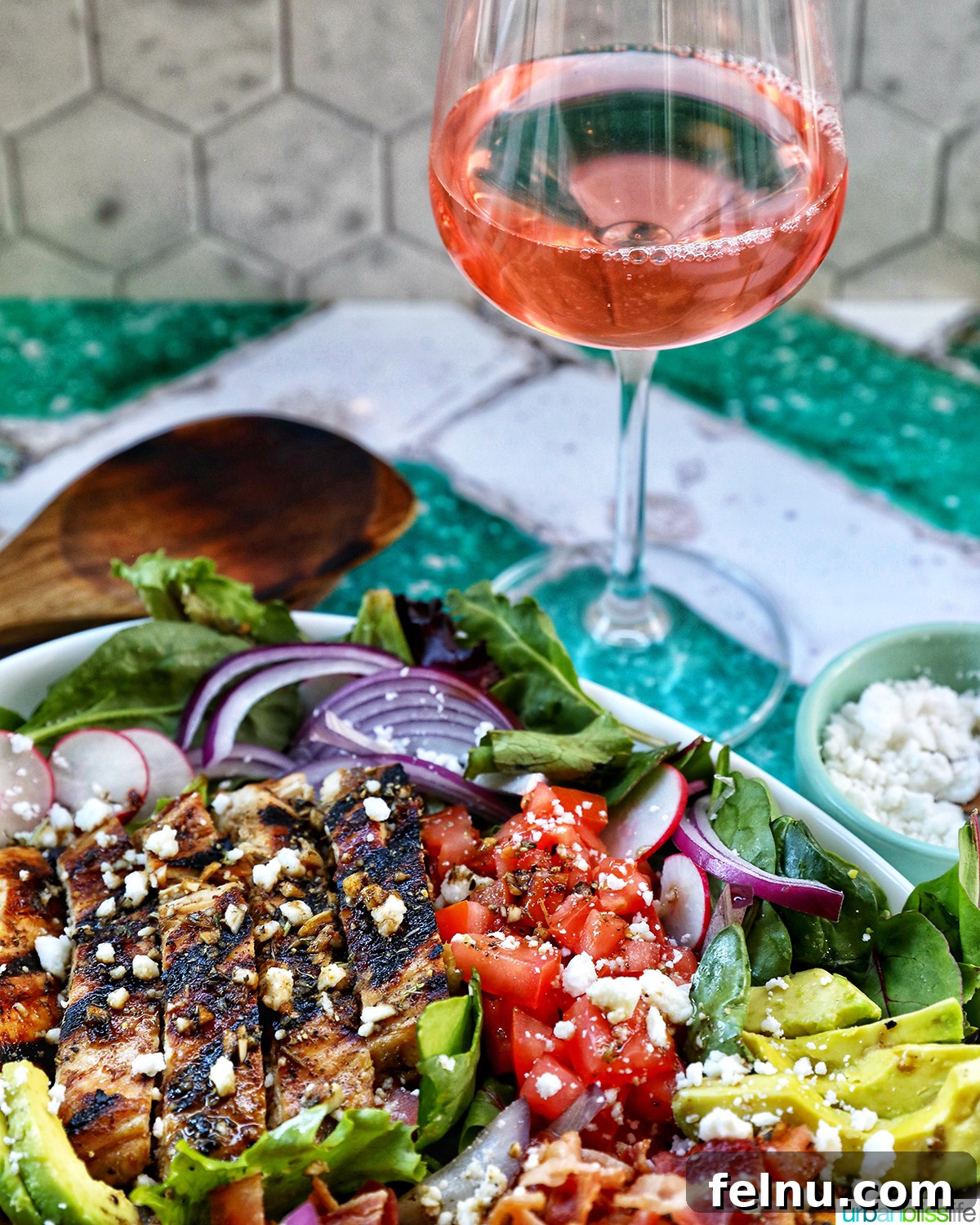 Tangy Balsamic Chicken Greens 16 Balsamic Chicken Salad elegantly presented with a glass of crisp rosé wine in the background, suggesting a perfect pairing.