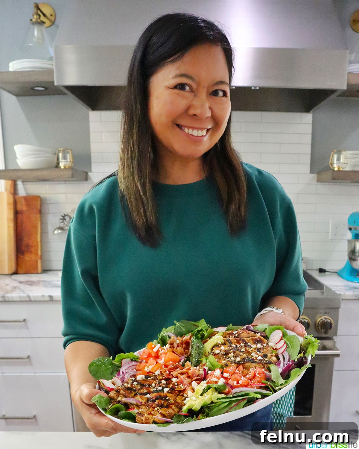 Tangy Balsamic Chicken Greens 17 Marlynn Jayme Schotland, the recipe creator, proudly holding a platter of her exquisite Balsamic Chicken Salad.