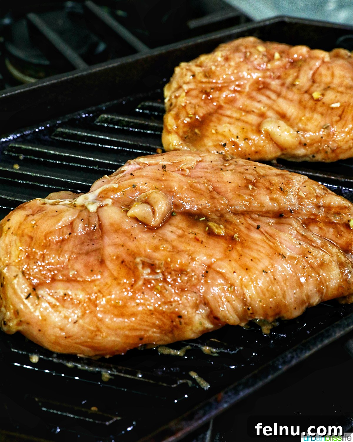 Tangy Balsamic Chicken Greens 7 Chicken breasts being expertly grilled on a grill pan, showing nice char marks.