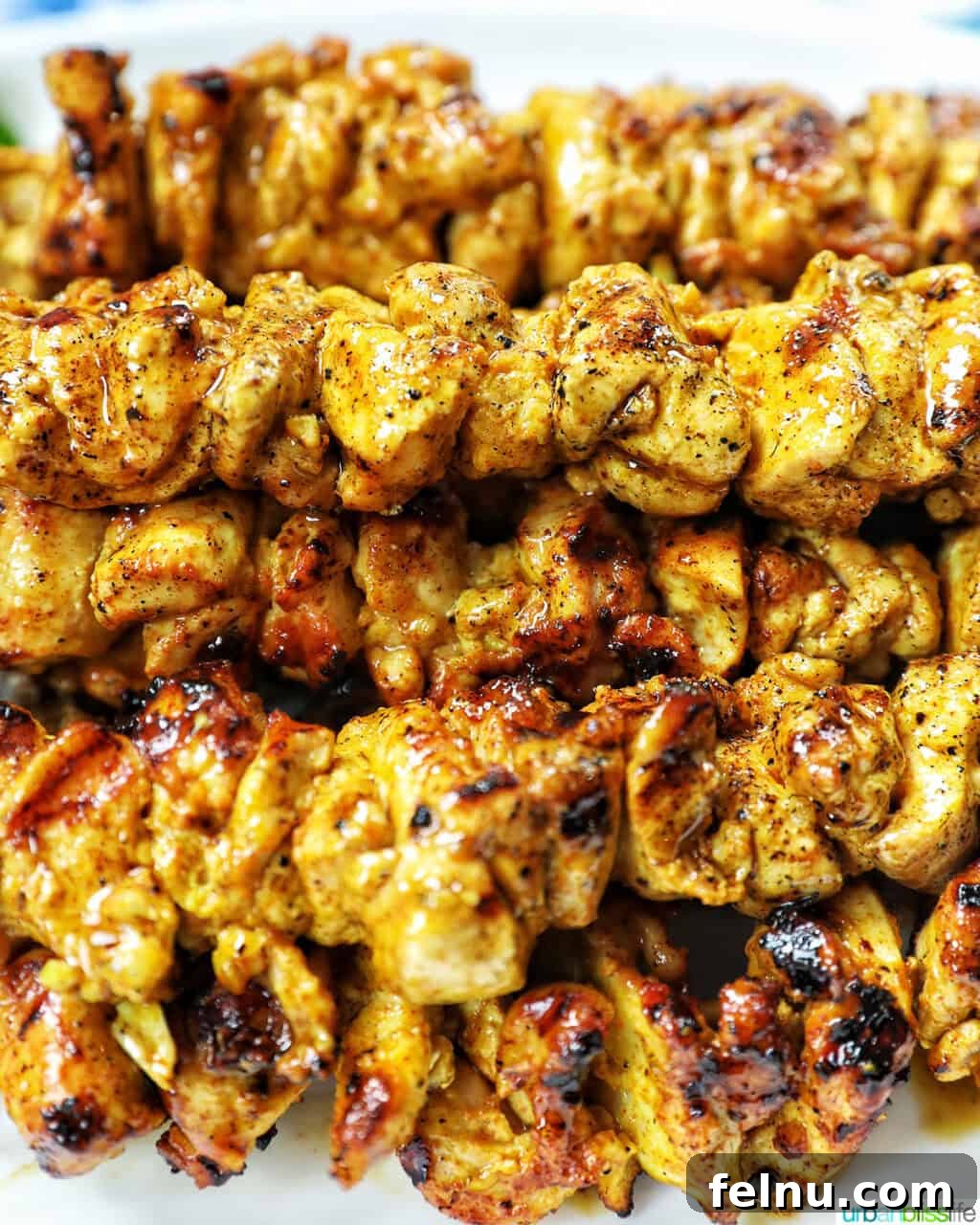 Tandoori Chicken Kebabs 14 Closeup of tandoori chicken skewers.