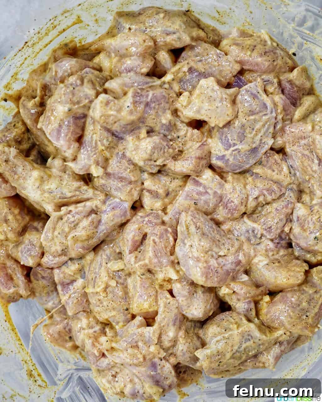 Tandoori Chicken Kebabs 8 Chicken marinating in tandoori marinade sauce.