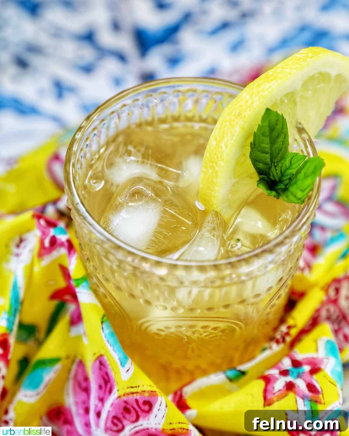 Bourbon Bliss: A Zesty Lemonade Twist 2 A refreshing glass of bourbon lemonade on a colorful napkin.