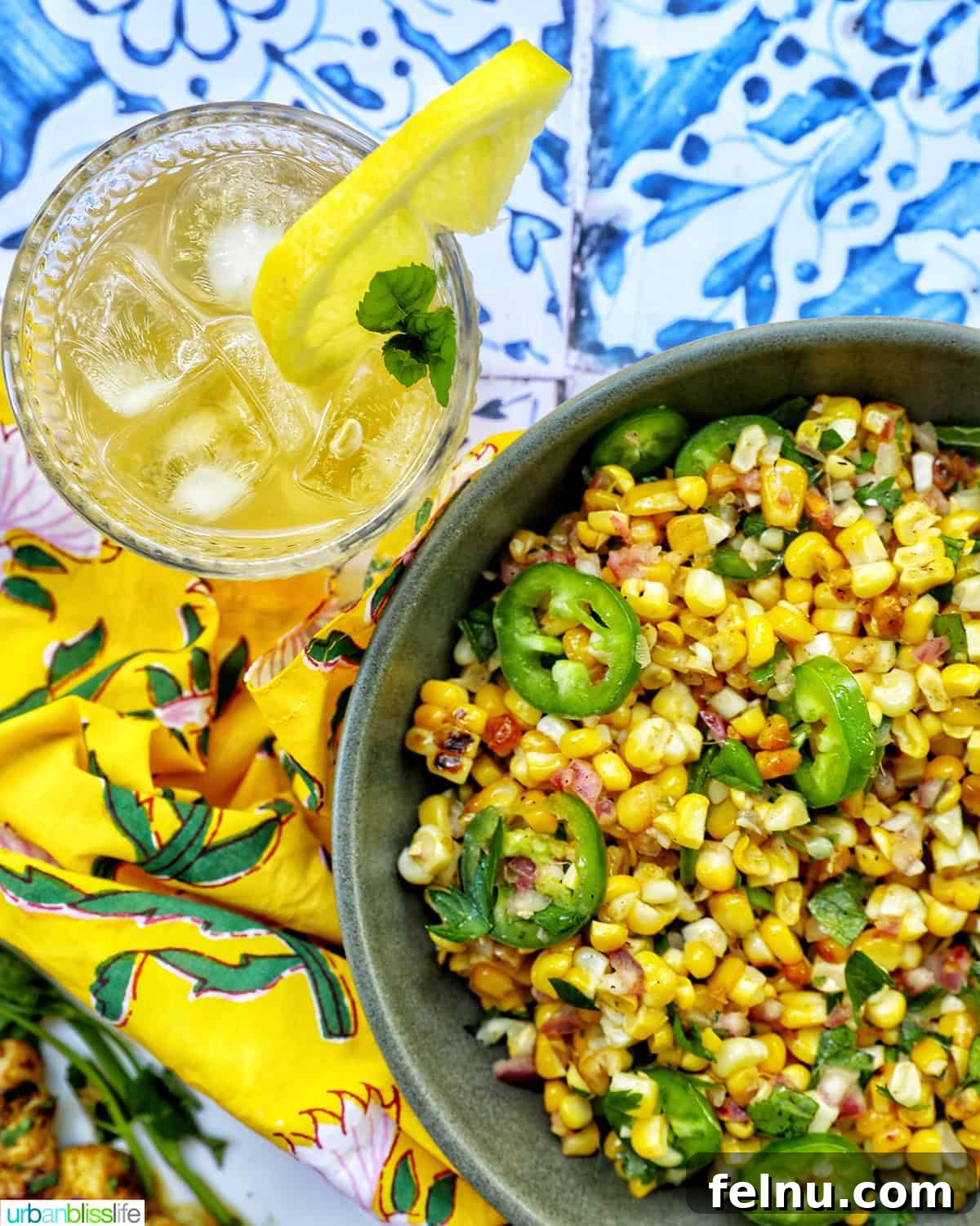 Bourbon Bliss: A Zesty Lemonade Twist 6 A bowl of delicious charred corn salad paired with a refreshing glass of bourbon lemonade.