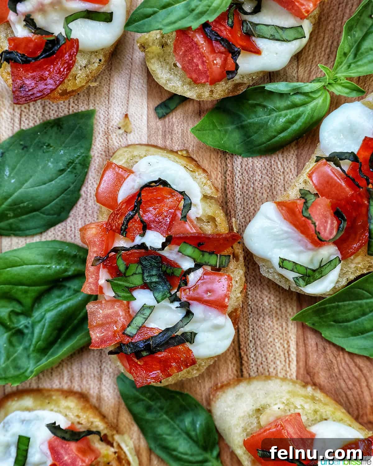 Close-up of delicious homemade crostini pizzas on a wooden serving board.
