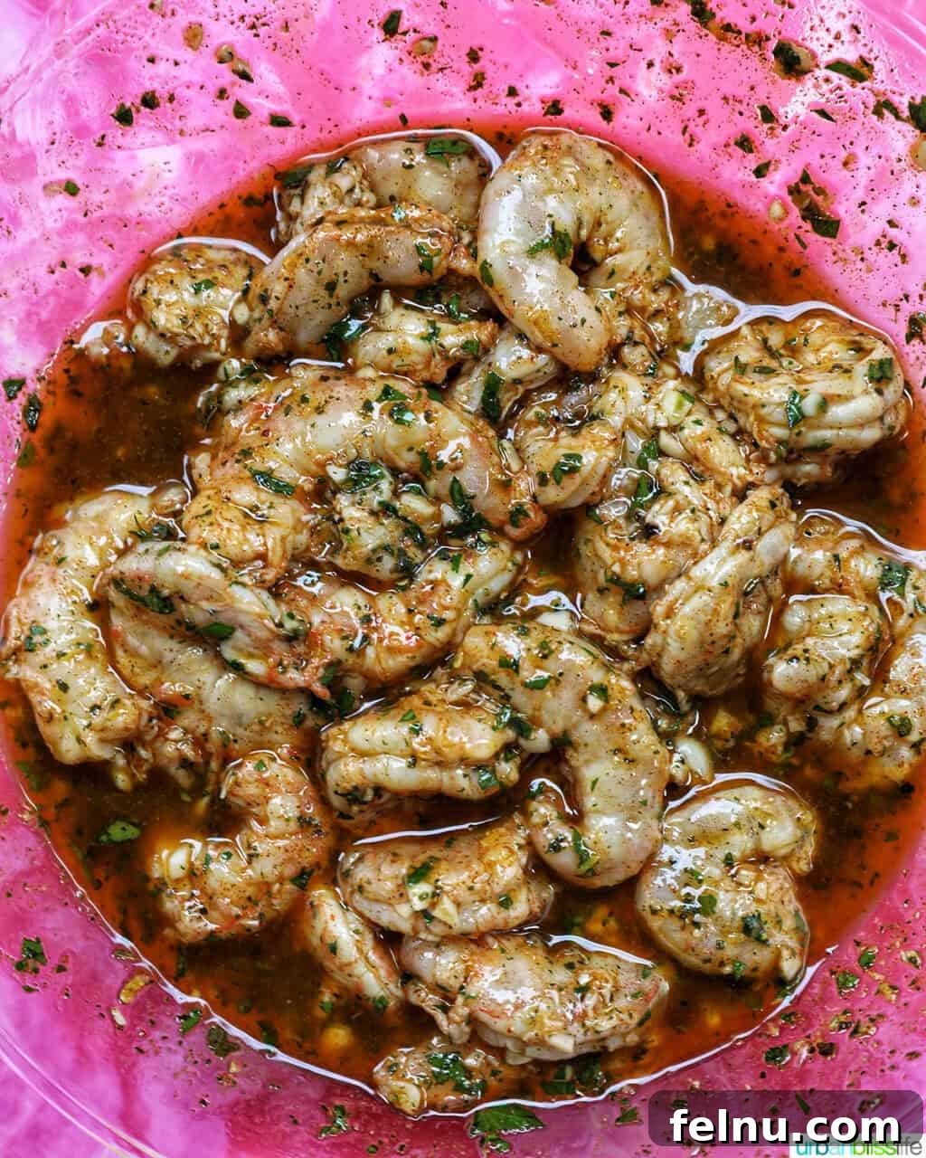 Grilled Shrimp Skewers with Chili-Lime Glaze 6 Large shrimp marinating in a flavorful marinade sauce.