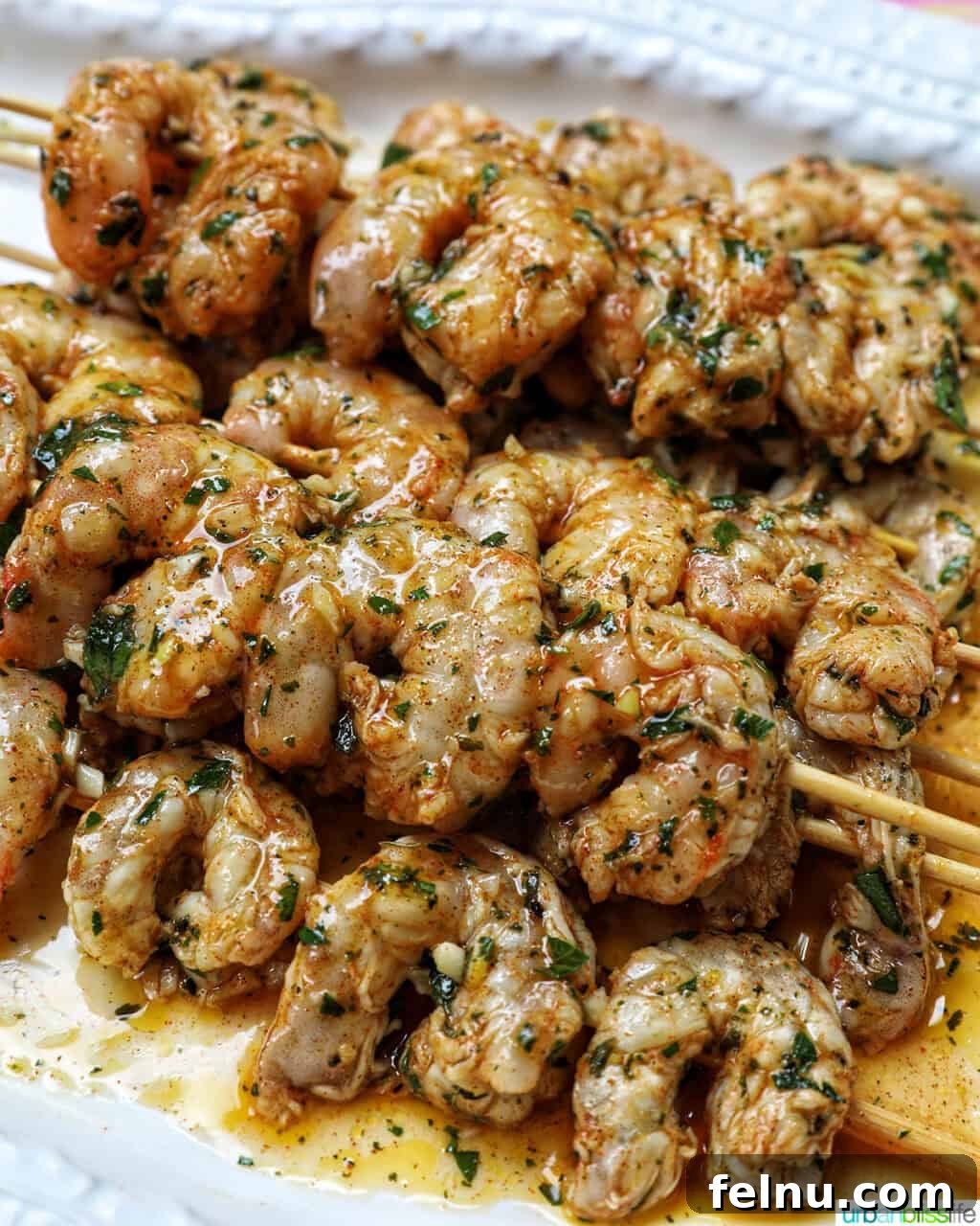 Grilled Shrimp Skewers with Chili-Lime Glaze 8 Perfectly grilled Prawn BBQ Skewers stacked and ready to serve.