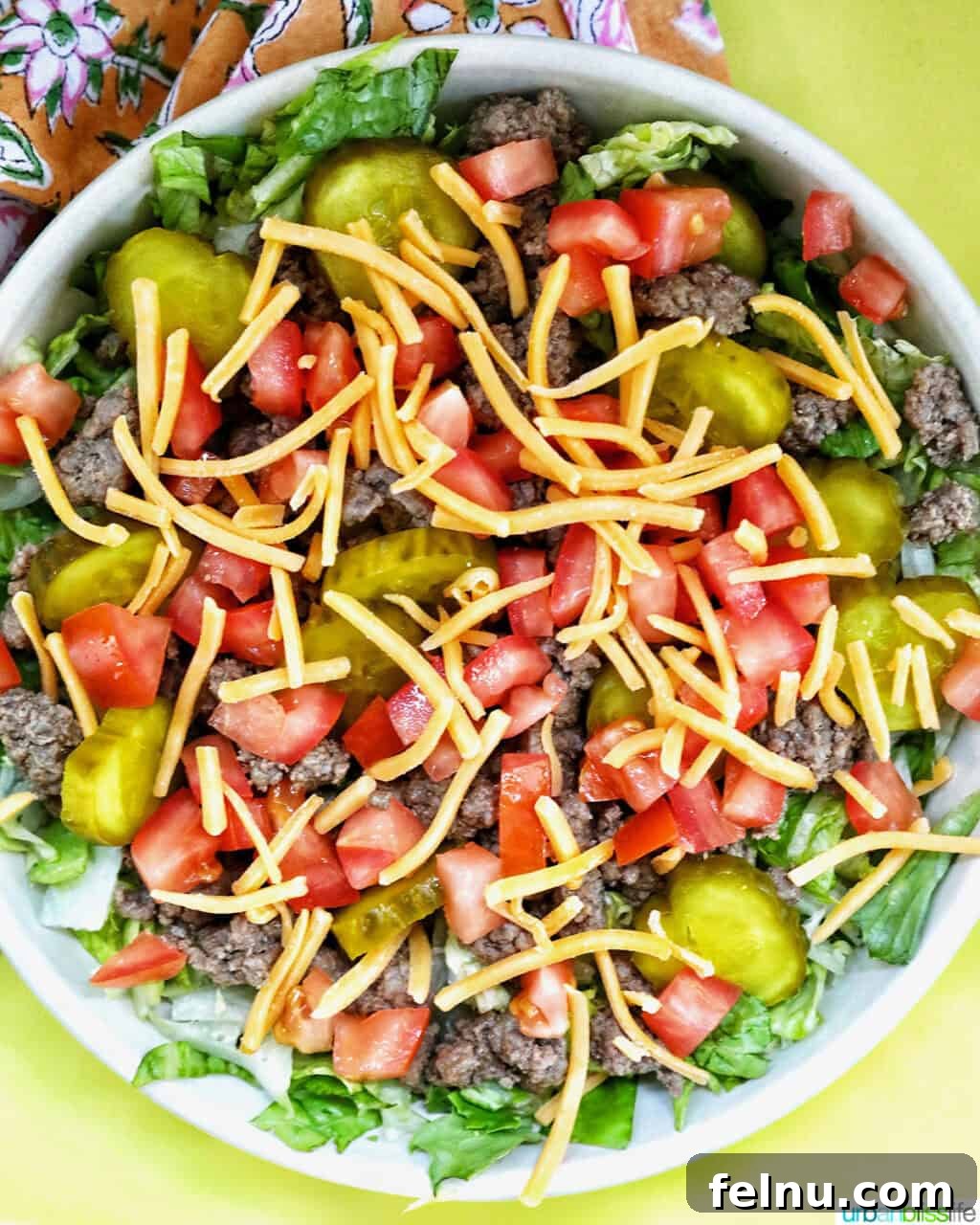 Big Mac Burger Bowl 11 Adding shredded cheese to a Big Mac salad bowl.